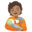 PERSON FEEDING BABY emoji with medium skin tone skin tone